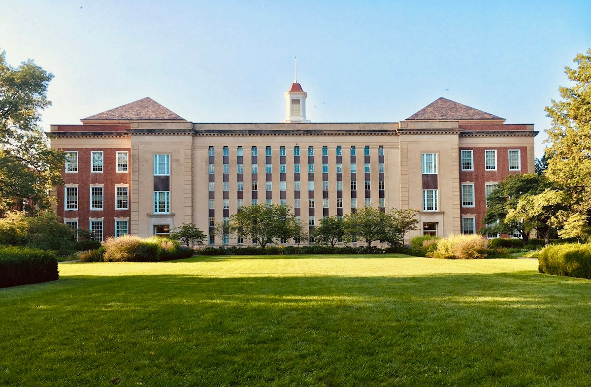 School building with classroom windows — roof works phasing keeps students away from work zones